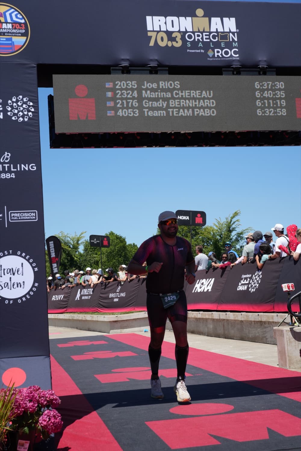Crossing the finish line at Ironman 70.3 Oregon